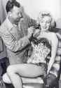 marilyn-monroe-gets-ready-for-scene-on-her-showgirl-costume-v0-rn66zt6ymi6h1.png