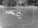 (Woman_lies_on_the_front_of_a_small_boat)_(AM_79575-1).jpg